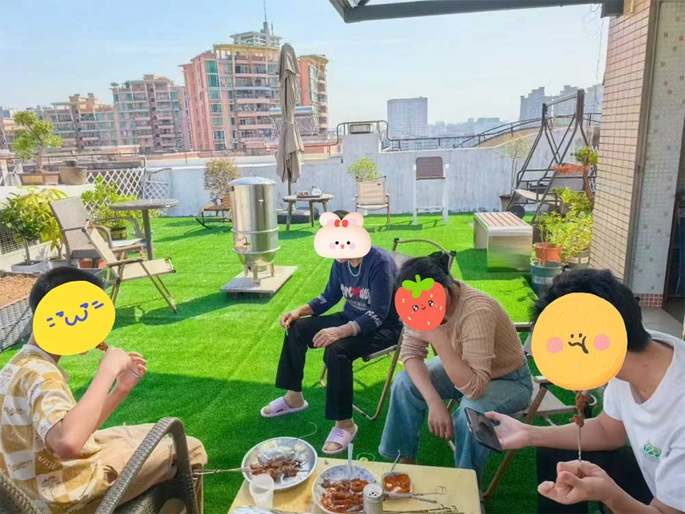 family gathering on durable artificial turf grass