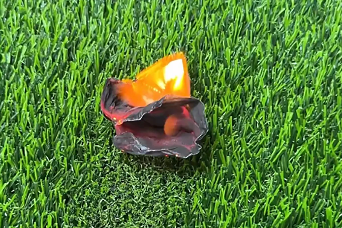 High-quality fireproof artificial turf resisting open flames and melting only at the contact point when exposed to high heat.