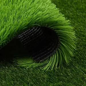 Close-up sample of high-density outdoor artificial turf for football fields showing durable black backing and vibrant green 50mm fibers banner