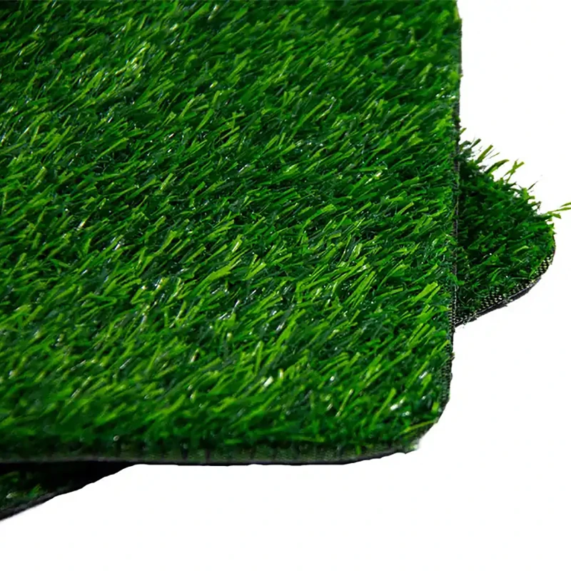 Close-up of premium non-toxic artificial grass samples for commercial landscaping, featuring high-density green fibers and durable backing banner
