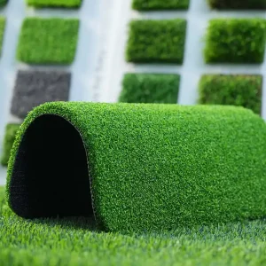 Artificial putting green turf compared with natural grass for commercial golf facilities