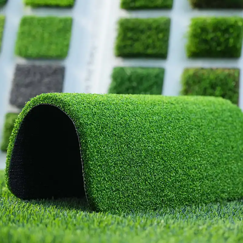 Artificial putting green turf compared with natural grass for commercial golf facilities