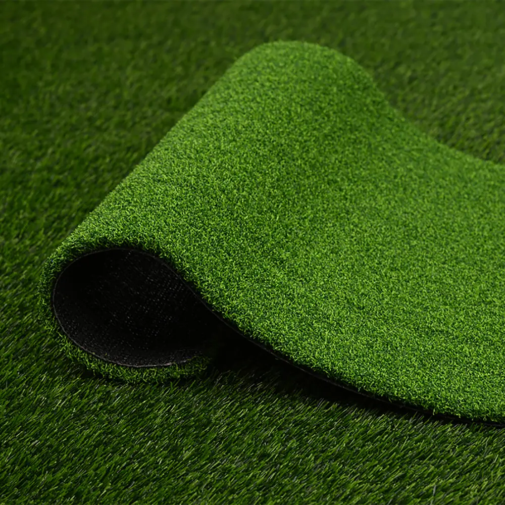 Durable and soft artificial grass roll showing dense fibers for safe playground flooring