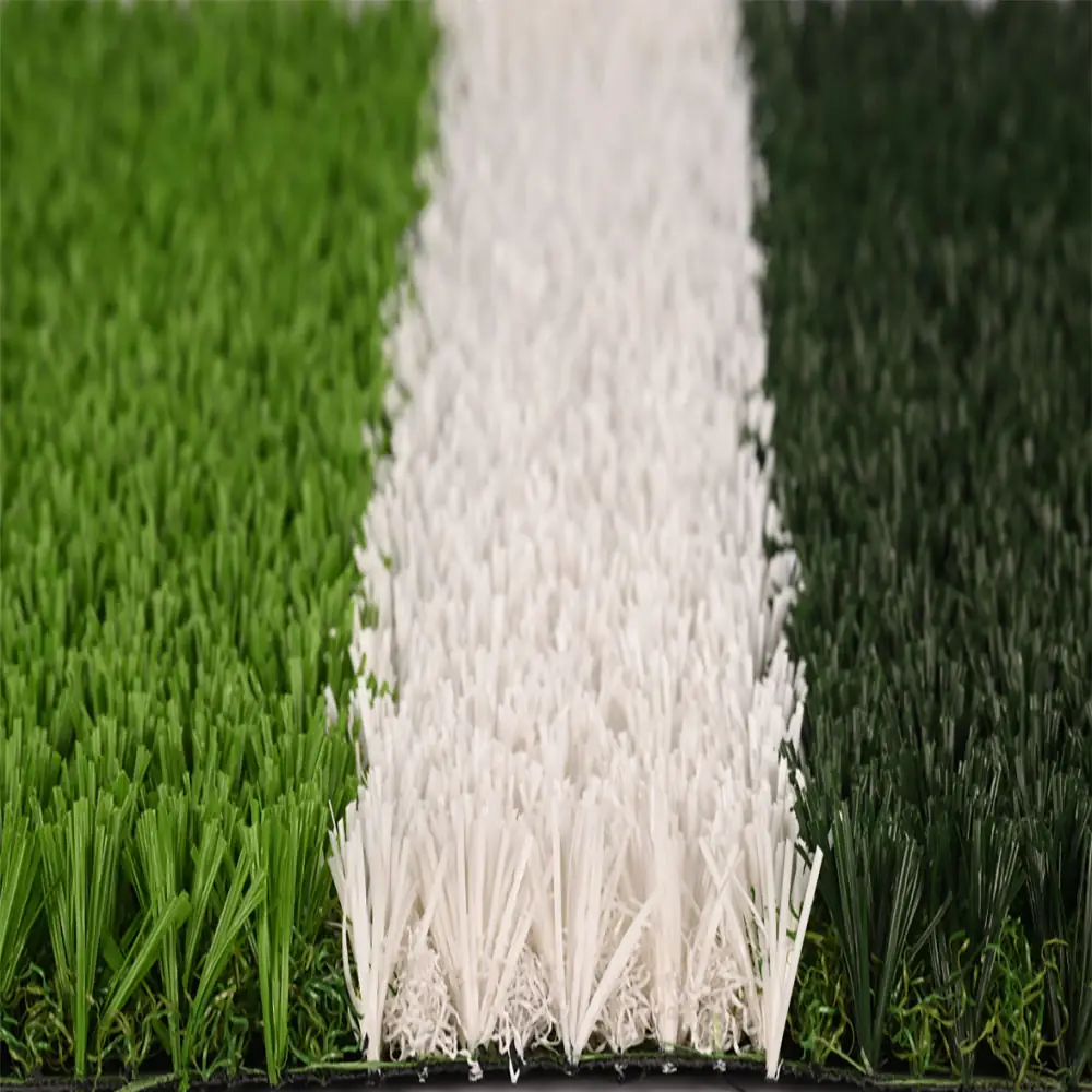 Artificial football turf with green grass fibers and white line marking for soccer fields.